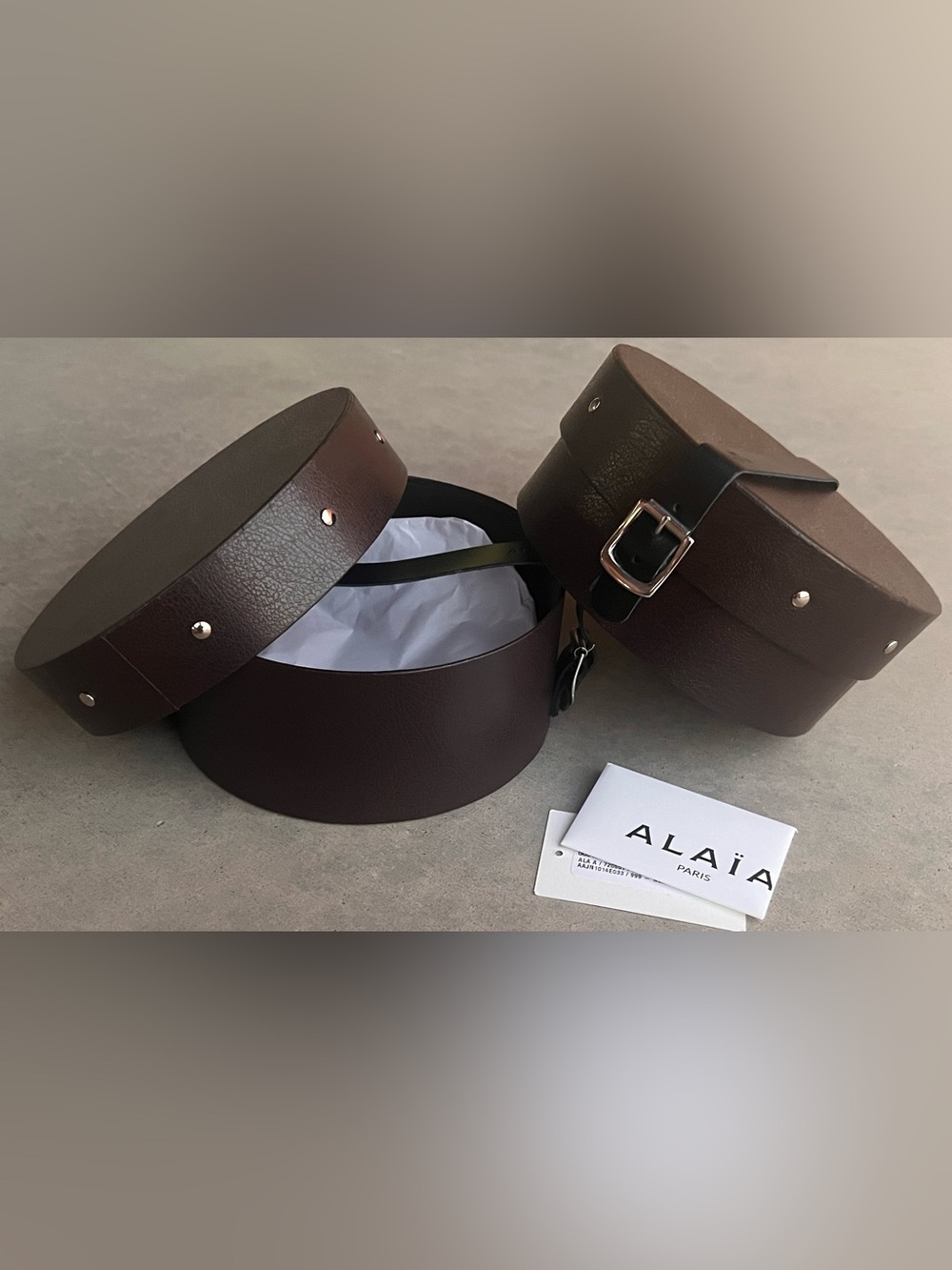 Alaia Paris Round Storage Cases Set of 2 Brown Buckle Strap Vanity Decor